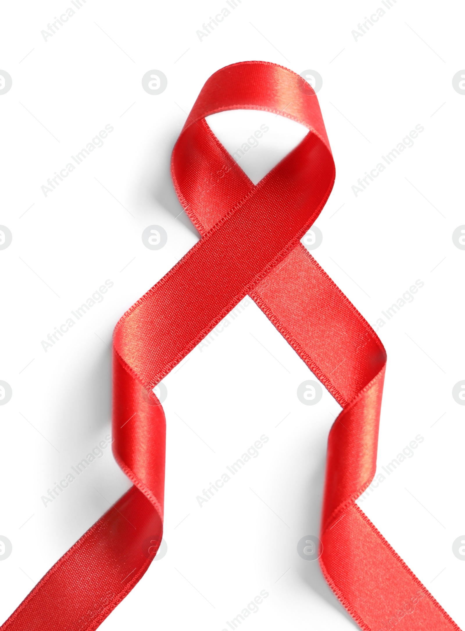 Photo of Red ribbon on white background, top view. Cancer awareness