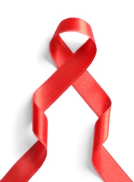 Red ribbon on white background, top view. Cancer awareness