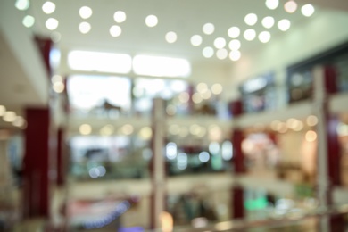 Photo of Blurred view of modern shopping mall interior