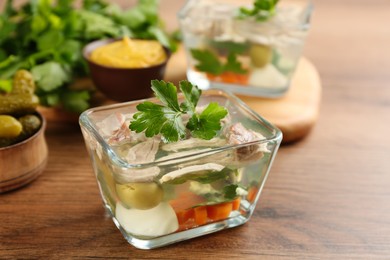 Delicious aspic with meat served on wooden table