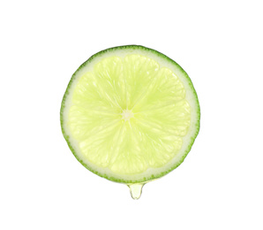 Slice of lime with dripping essential oil isolated on white