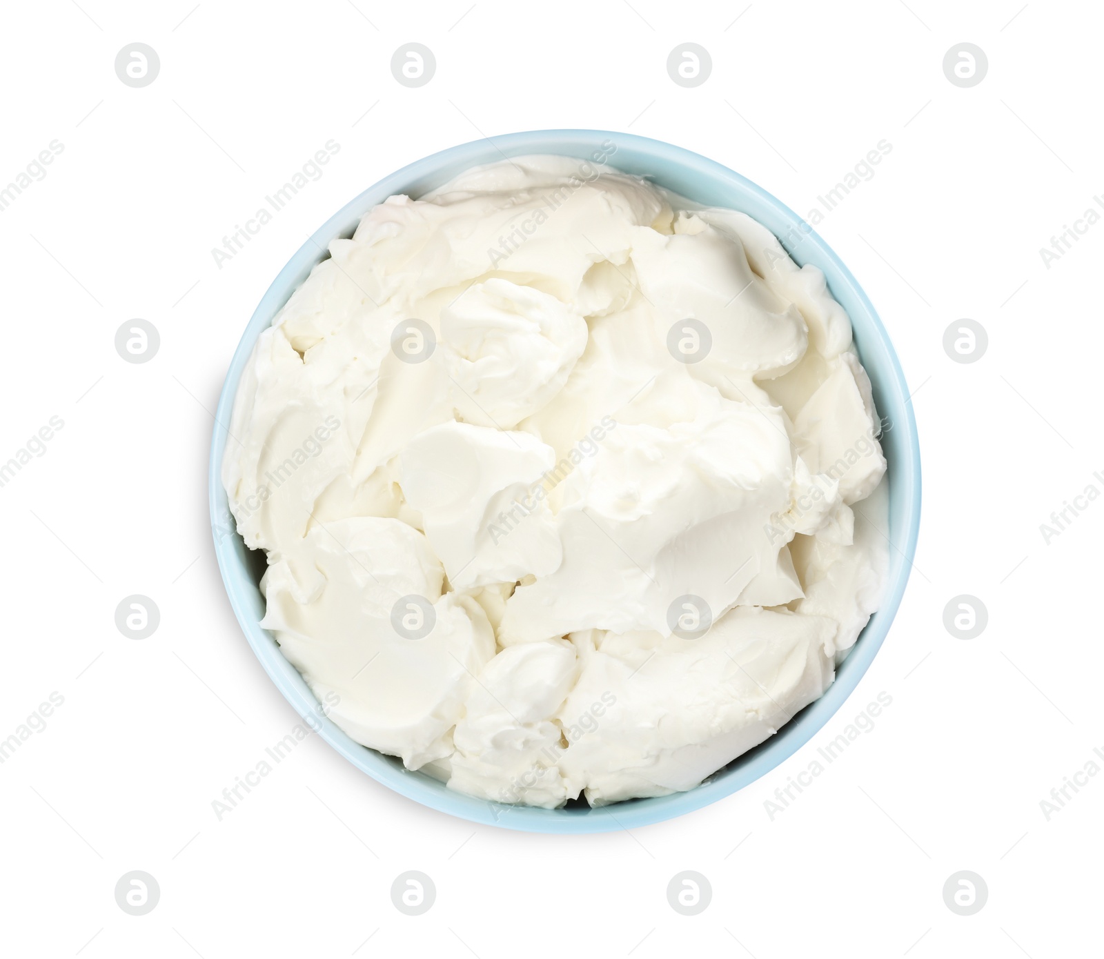 Photo of Bowl of tasty cream cheese isolated on white, top view