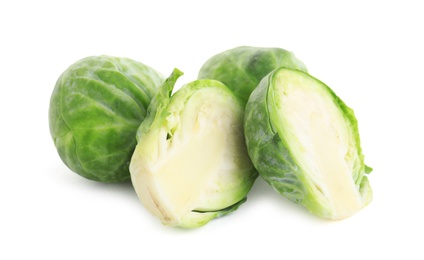 Photo of Cut fresh Brussels sprouts isolated on white