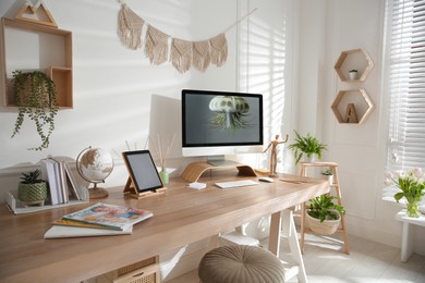 Photo of Stylish home office interior with comfortable workplace