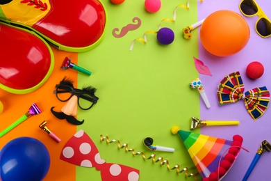 Photo of Flat lay composition with clown's accessories on color background. Space for text