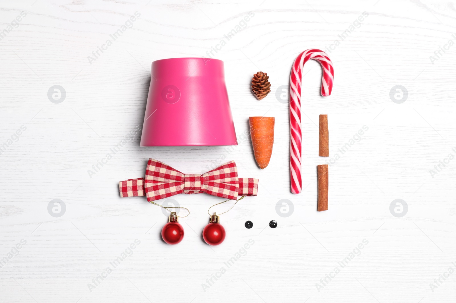 Photo of Set of elements for snowman on white wooden background, flat lay