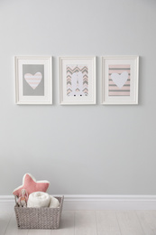 Photo of Stylish baby room interior with cute pictures on wall