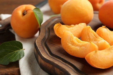 Photo of Composition with delicious ripe sweet apricots, closeup view. Space for text