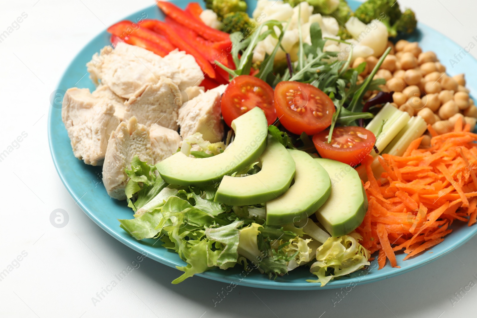 Photo of Balanced diet and healthy foods. Plate with different delicious products on white table, closeup