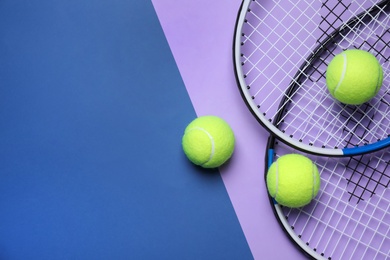 Photo of Tennis rackets and balls on color background, flat lay. Space for text