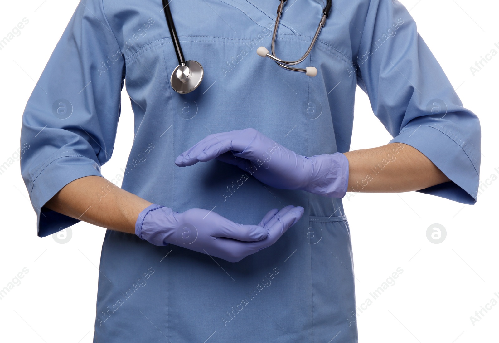 Photo of Doctor with stethoscope holding something on white background, closeup. Cardiology concept