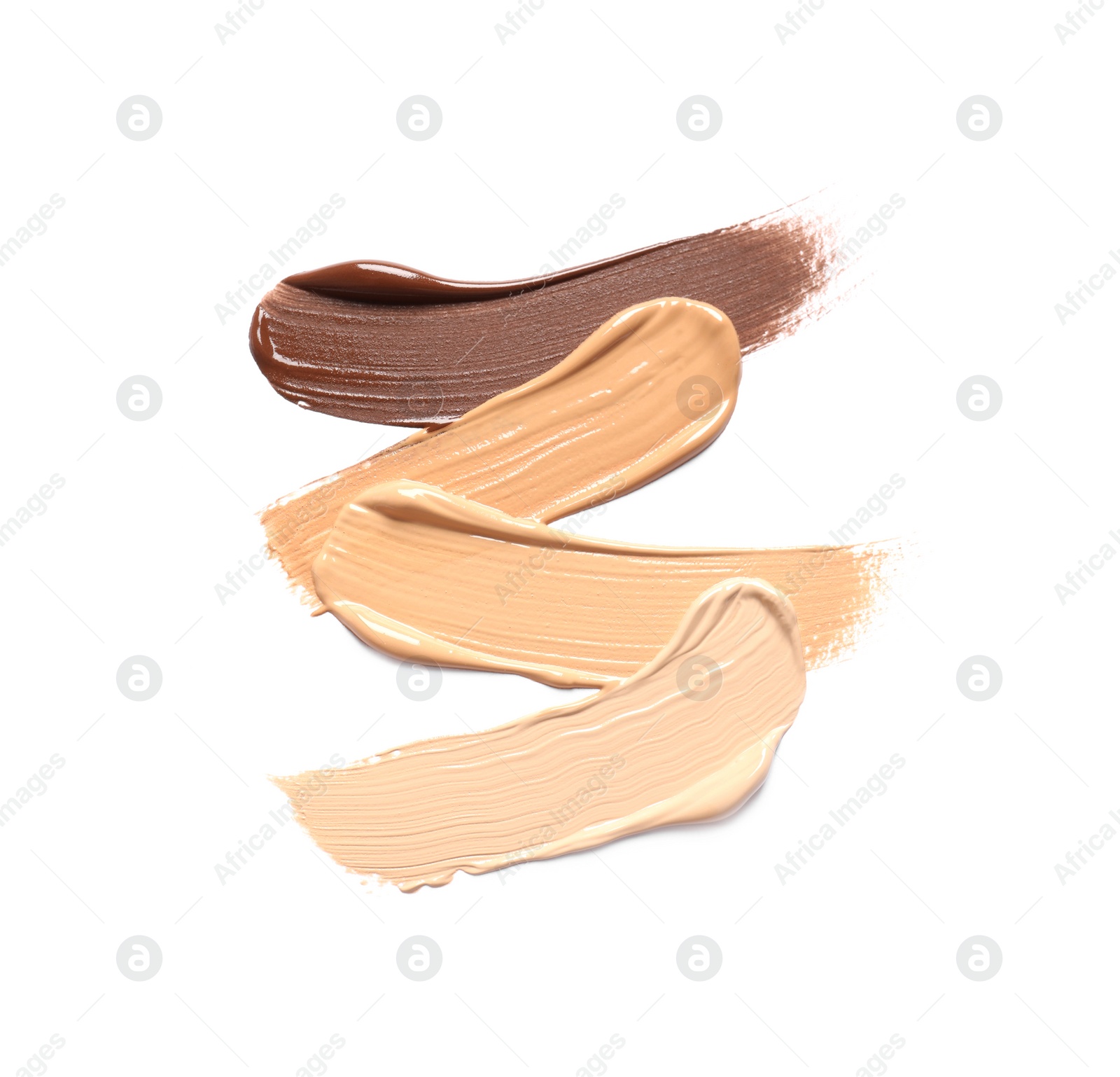 Photo of Samples of skin foundation on white background, top view