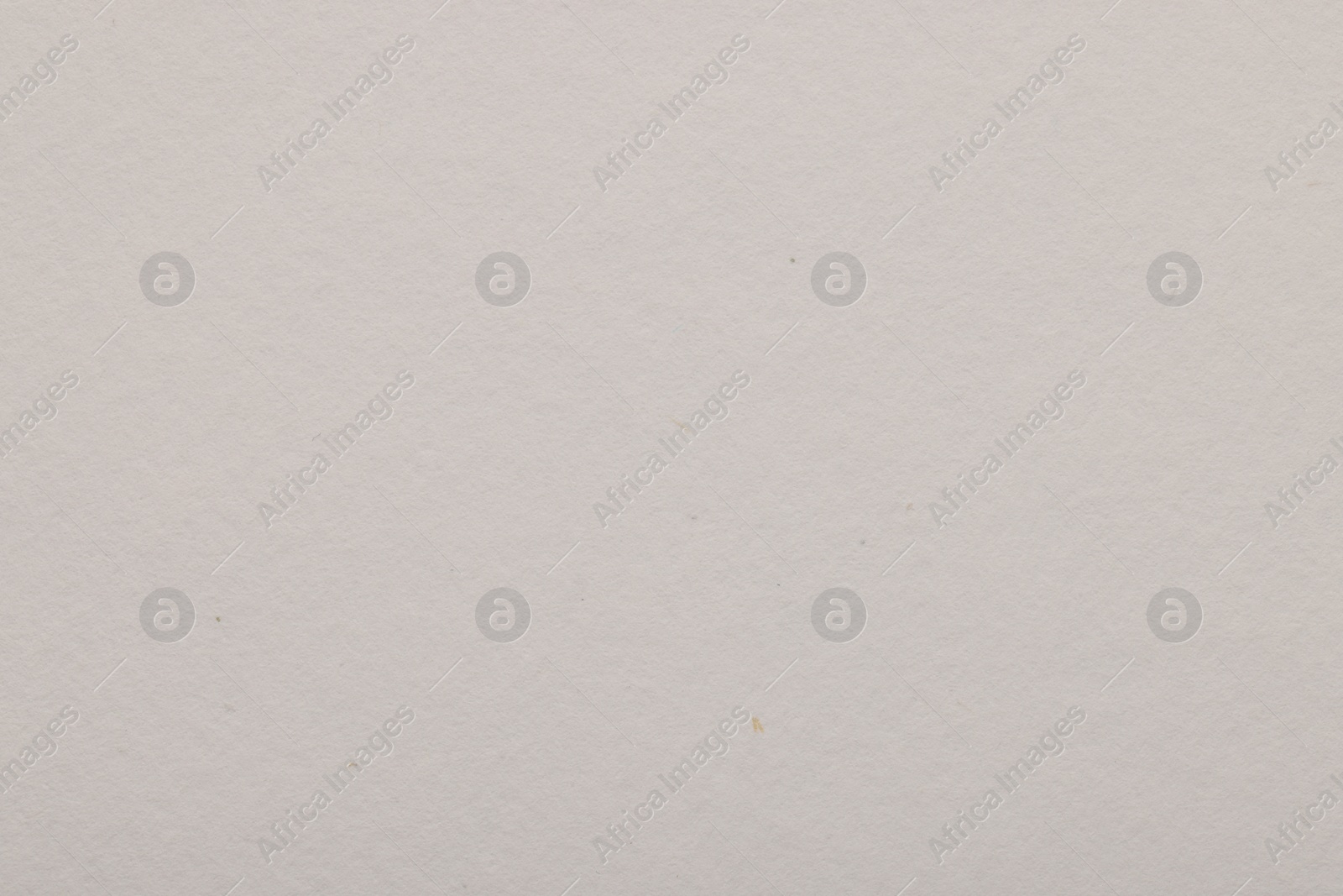 Photo of Texture of light grey paper sheet as background, top view