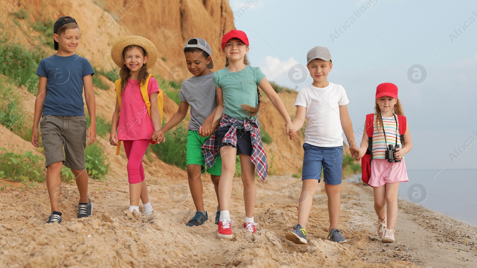 Photo of Cute little children outdoors on summer day. Camping trip