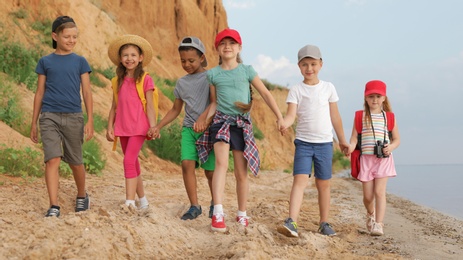 Photo of Cute little children outdoors on summer day. Camping trip