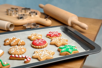 Photo of Tasty colorful Christmas cookies on baking tray