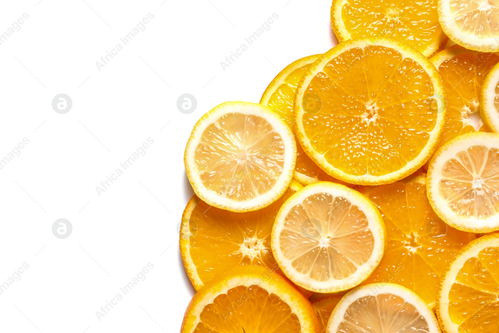 Photo of Slices of fresh citrus fruits on white background, top view