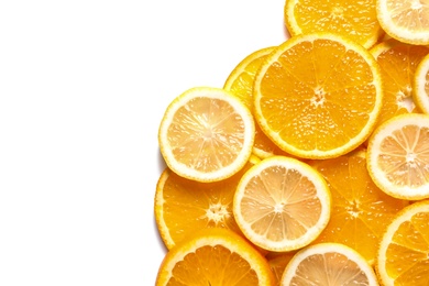 Slices of fresh citrus fruits on white background, top view