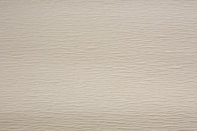 Texture of beige paper as background, closeup view