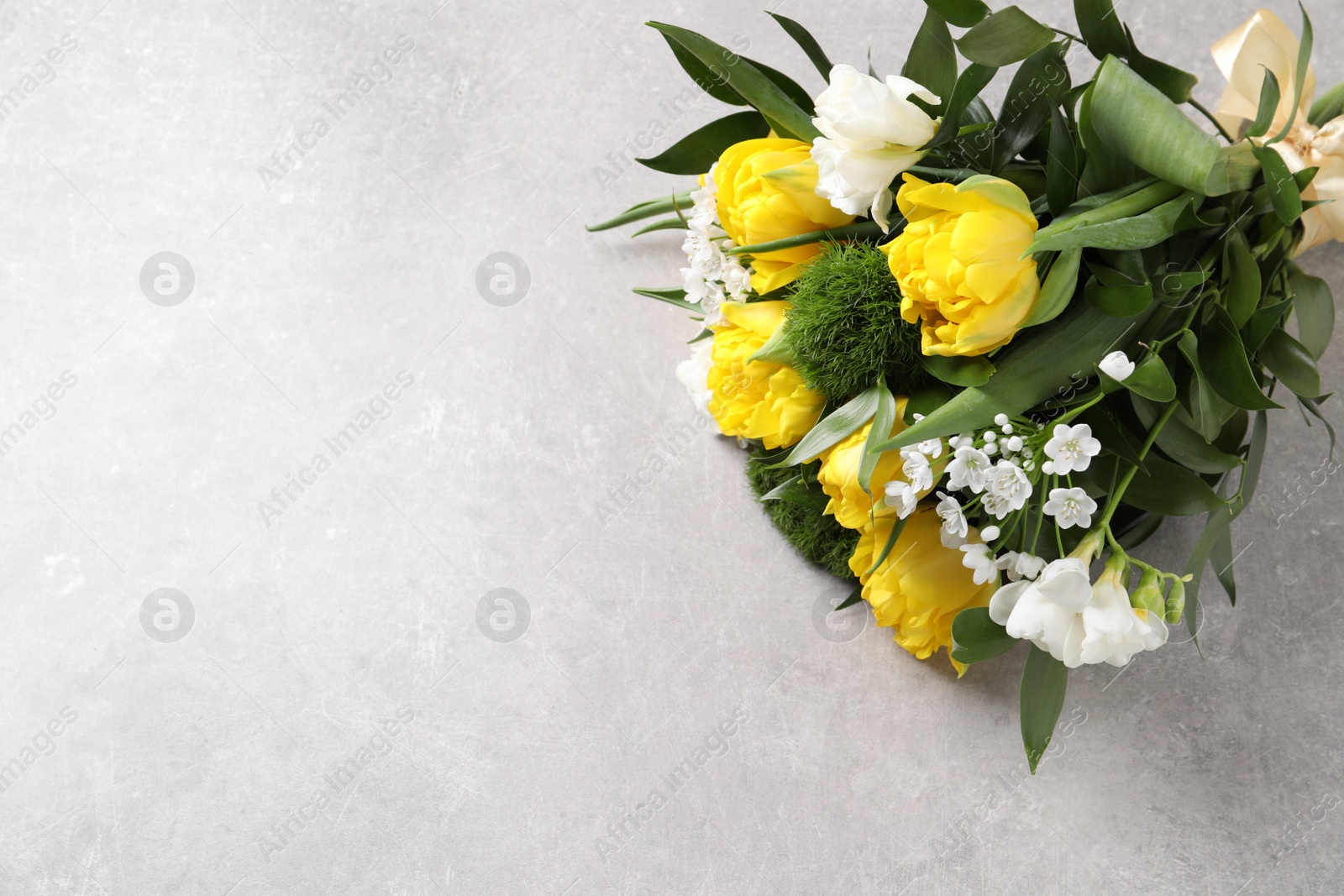Photo of Beautiful bouquet with peony tulips on light background, top view. Space for text