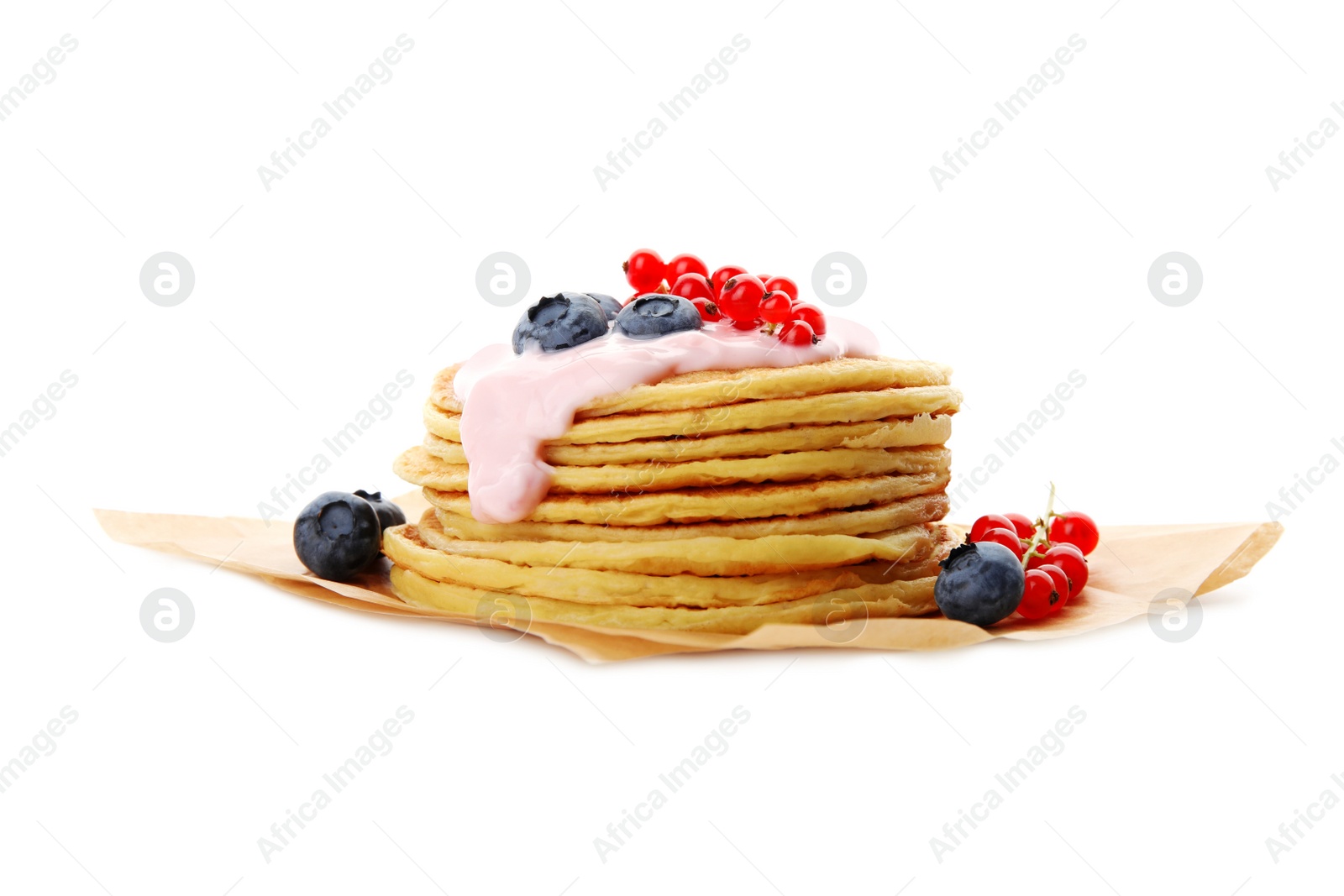 Photo of Tasty pancakes with natural yogurt, blueberries and red currants on white background