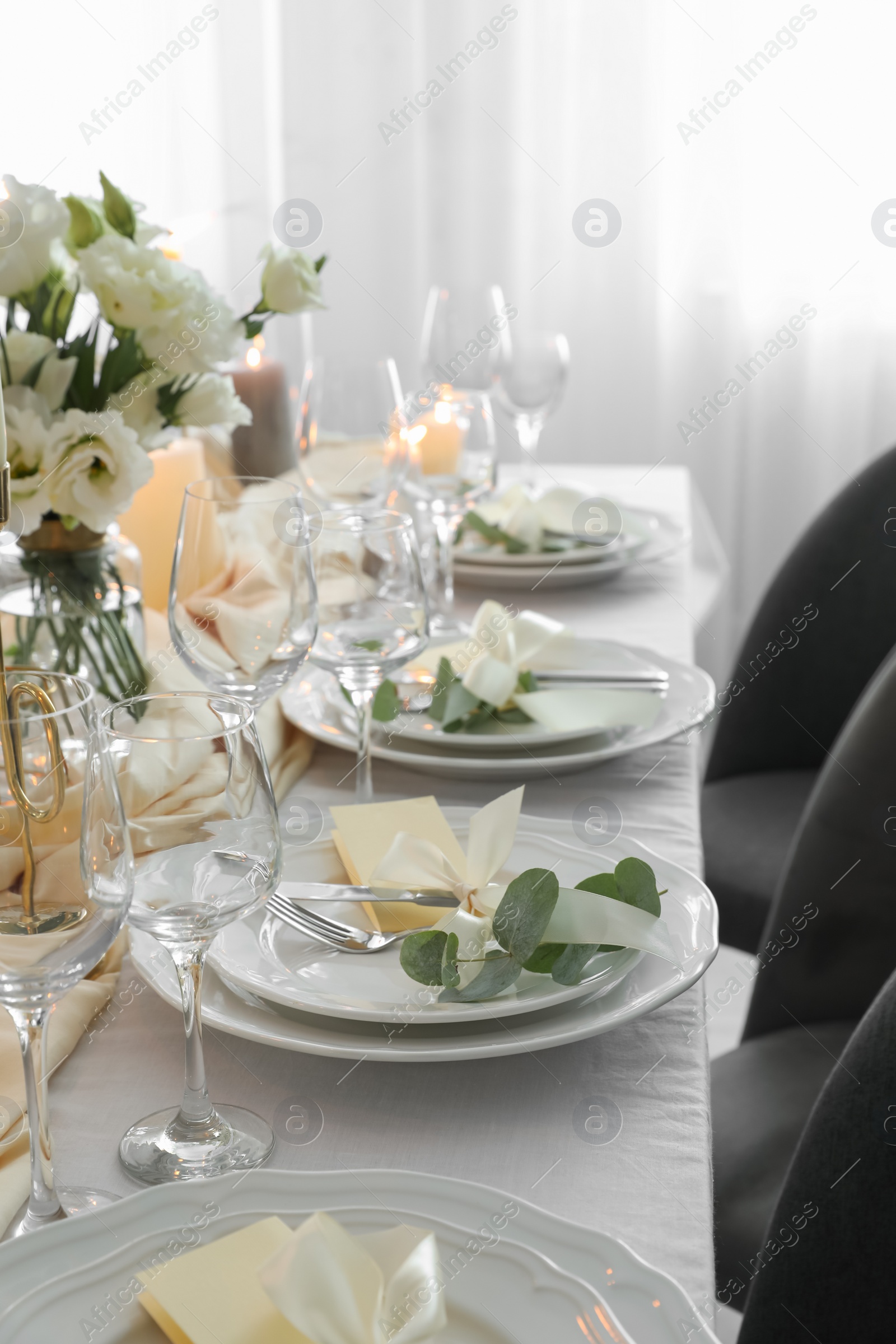 Photo of Festive table setting with beautiful floral decor in restaurant