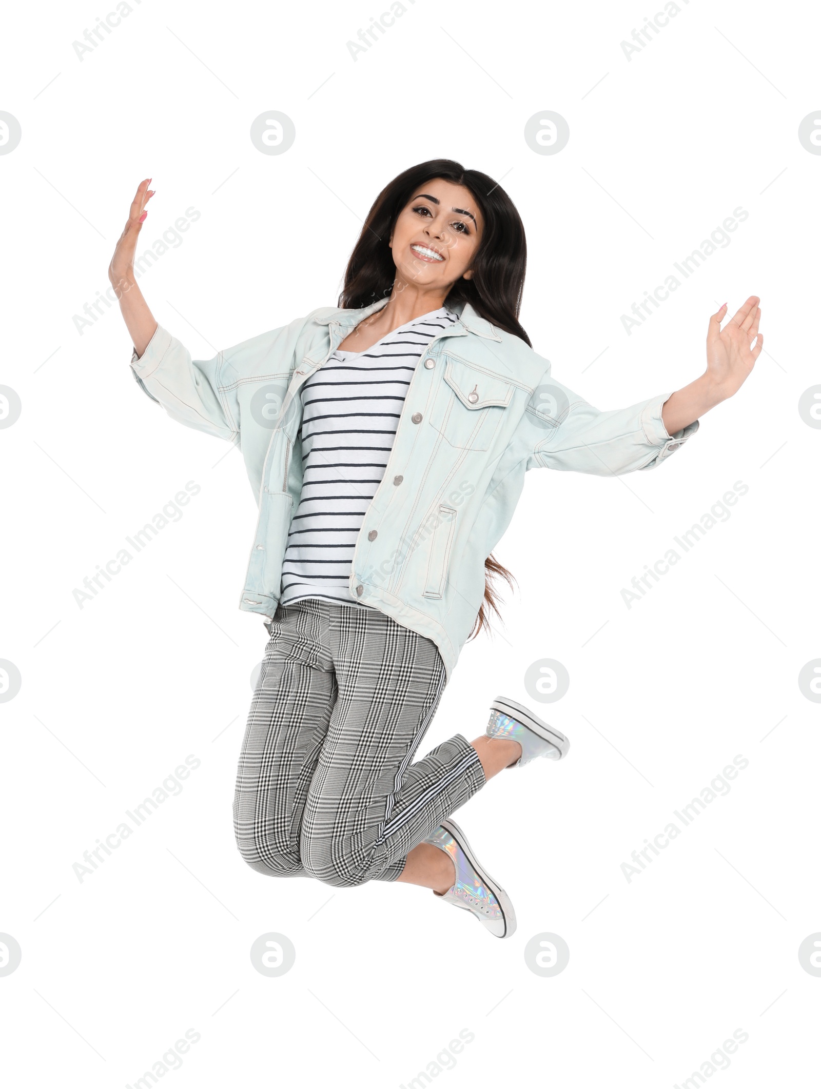 Photo of Full length portrait of jumping young woman on white background