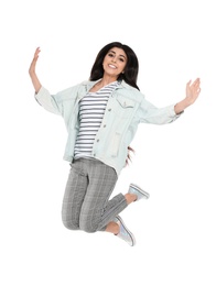 Full length portrait of jumping young woman on white background