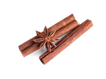 Cinnamon sticks and anise star isolated on white, top view