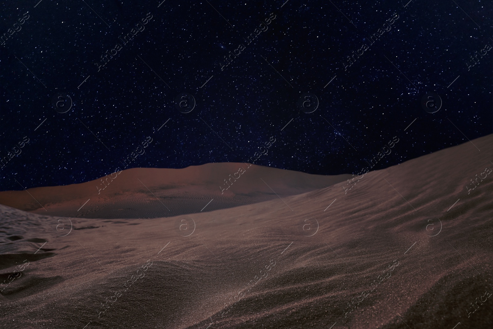 Image of Scenic view of sandy desert under starry sky in night 