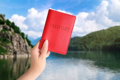 Image of Woman holding passport and beautiful view of lake on background