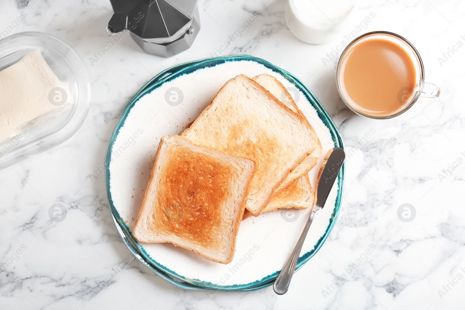 Photo of Plate with toasted bread and cup of coffee on table, top view