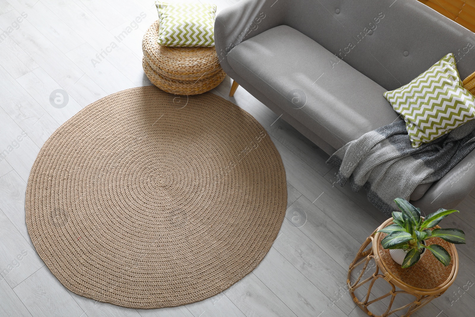 Photo of Stylish rug on floor in living room, above view