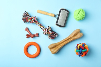 Flat lay composition with accessories for dog on color background. Pet care