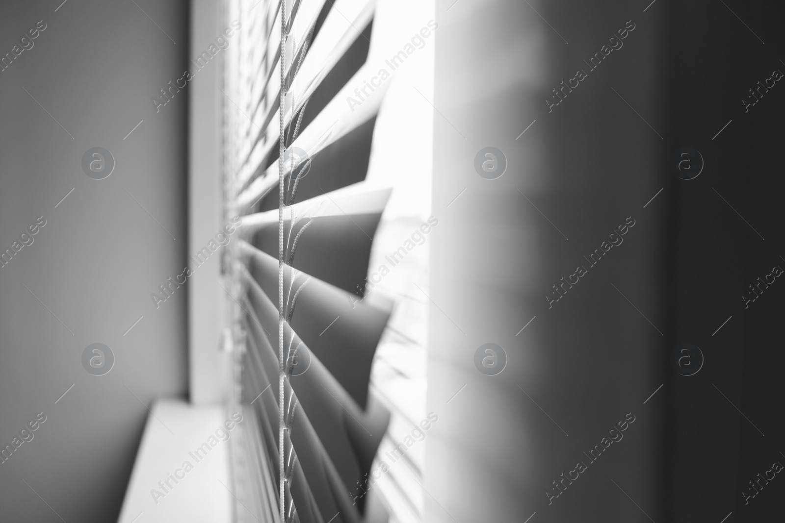 Photo of Closeup view of stylish horizontal window blinds