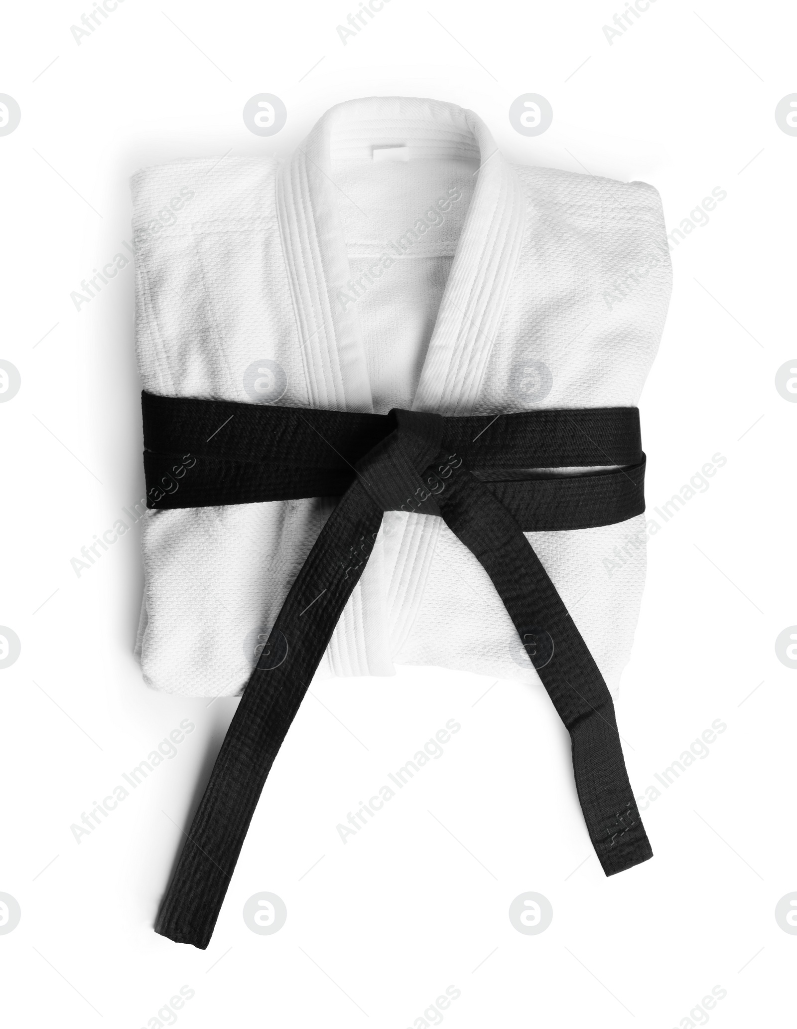 Photo of Martial arts uniform with black belt on white background, top view