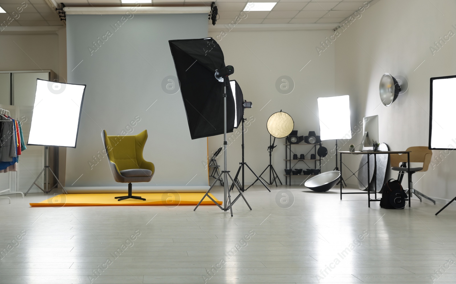 Photo of Interior of modern photo studio with professional equipment