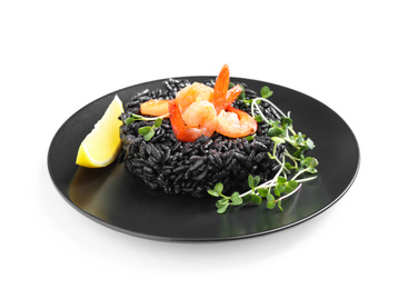 Photo of Delicious black risotto with shrimps and lemon isolated on white