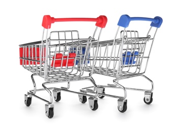 Photo of Empty metal shopping trolleys isolated on white