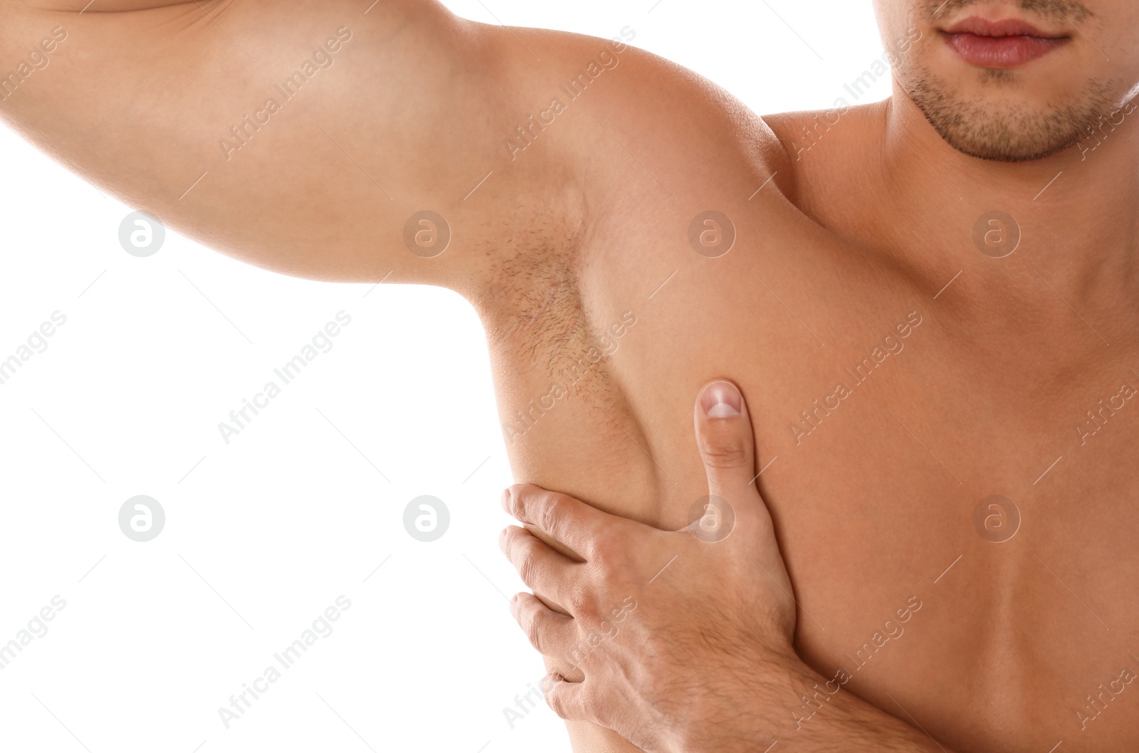 Photo of Young man showing hairy armpit on white background, closeup. Epilation procedure