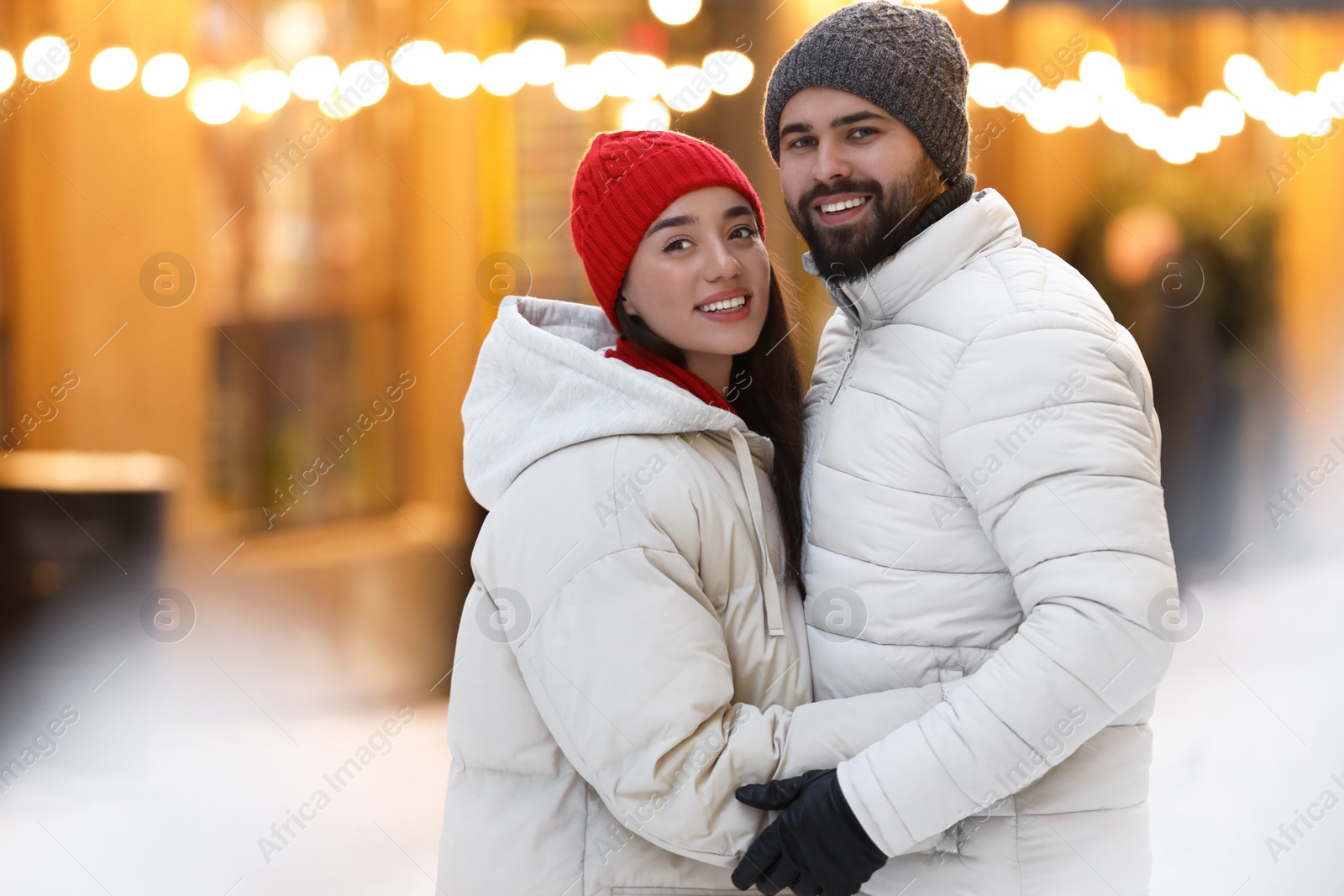 Photo of Lovely couple spending time together on city street