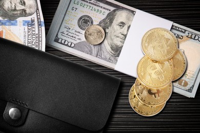 Image of Bitcoins, dollar banknotes, coins and wallet on black wooden background, flat lay