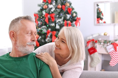 Mature couple together at home. Christmas celebration