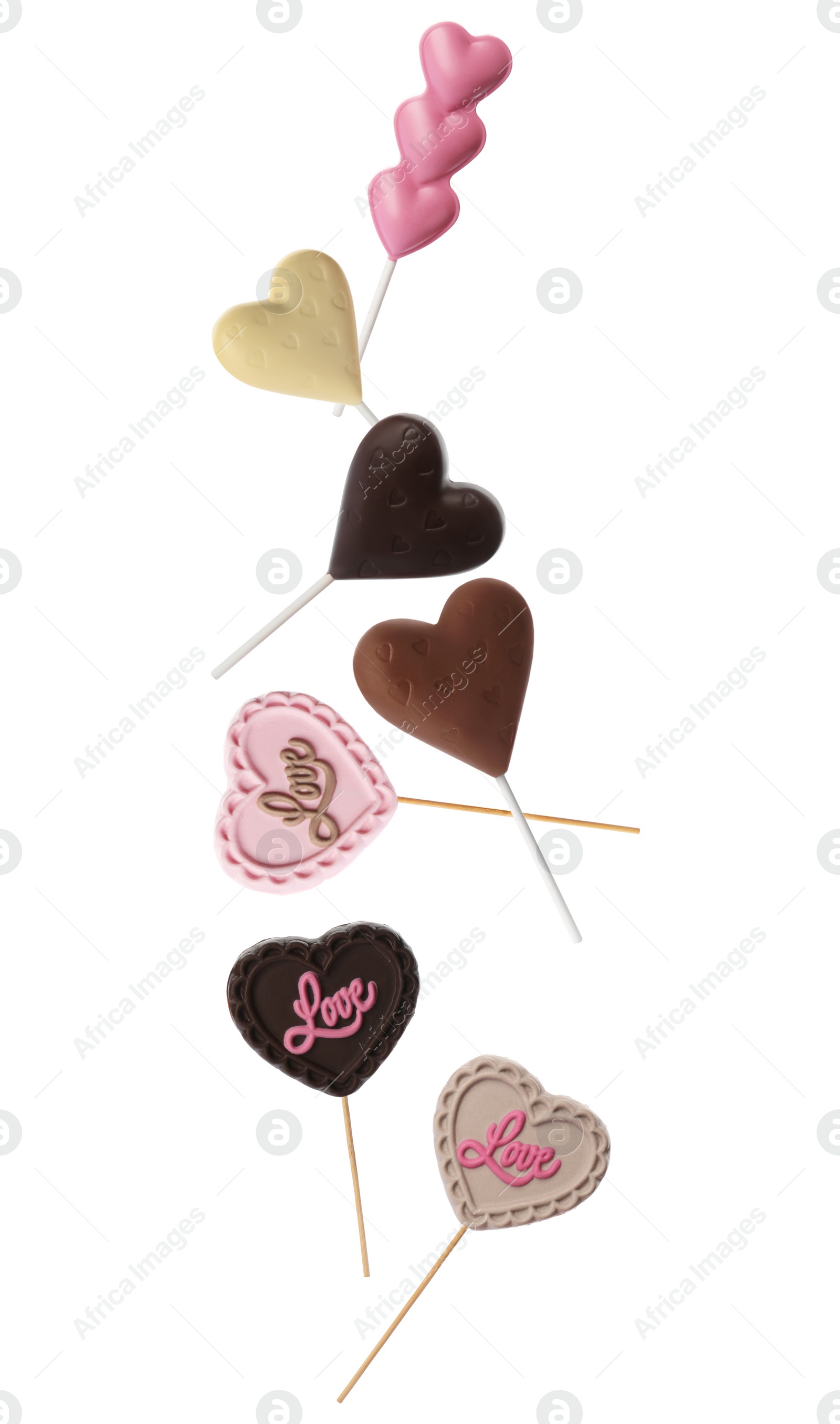 Image of Set with heart shaped lollipops made of chocolate on white background 