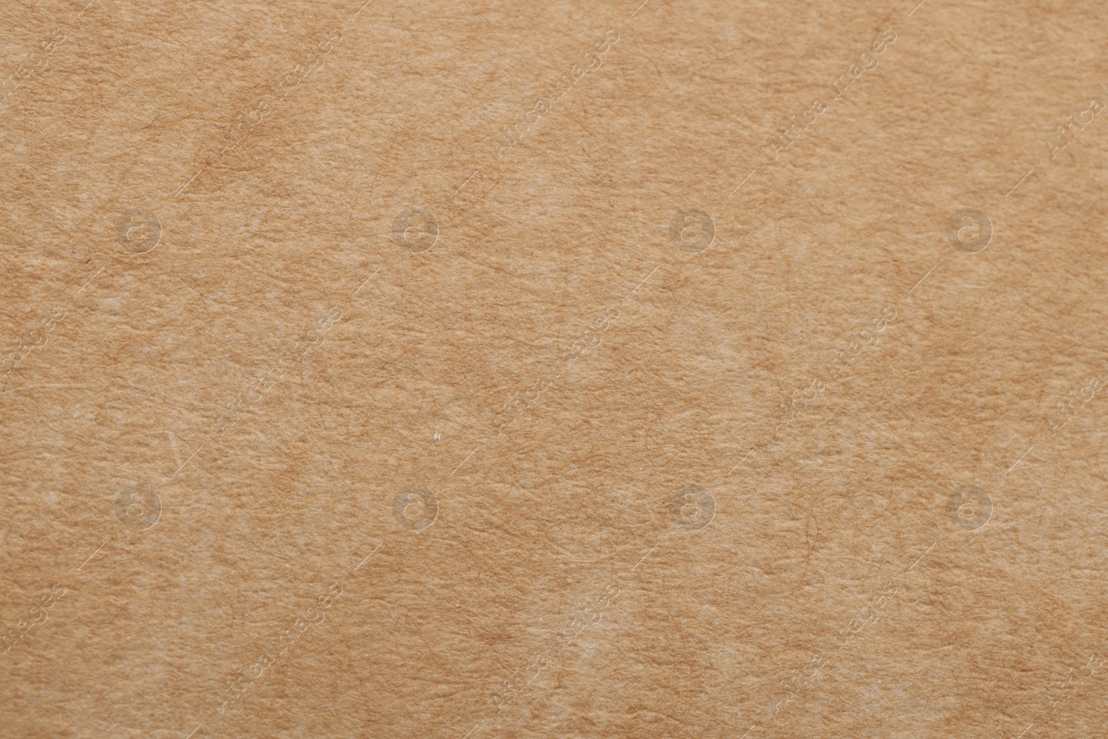 Photo of Texture of beige paper sheet as background, top view