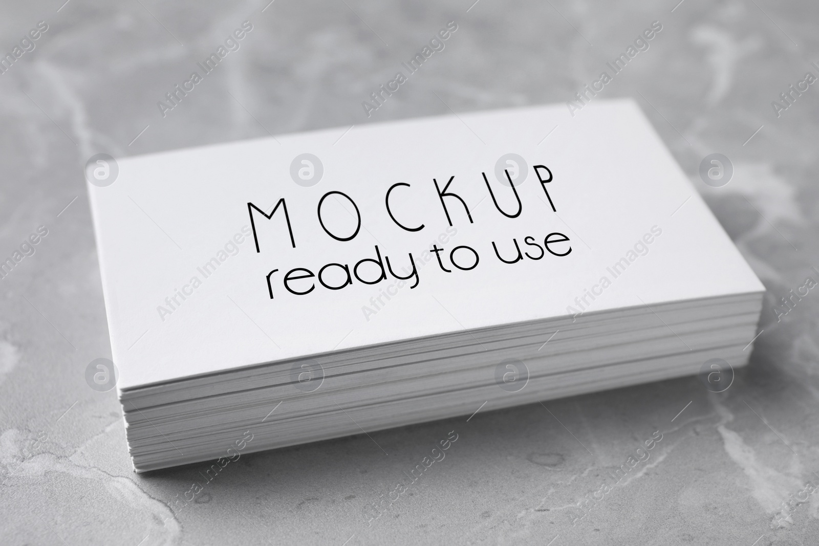 Image of Stack of business cards with text Mockup Ready To Use on top