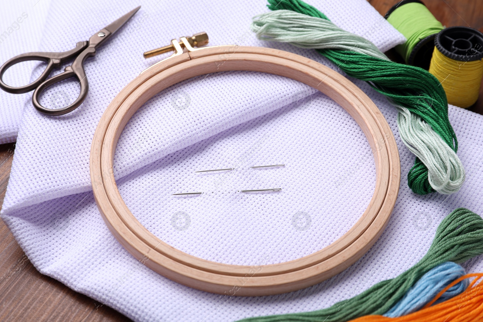 Photo of Set of embroidery equipment on wooden table