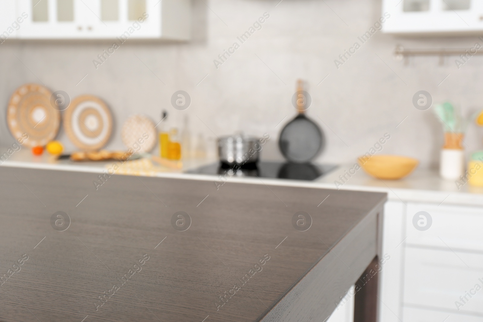 Photo of Stylish wooden table in kitchen. Interior design