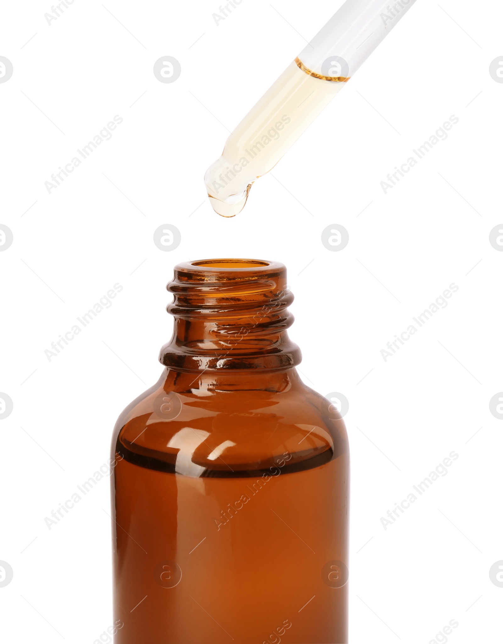 Photo of Brown bottle and dropper with essential oil on white background