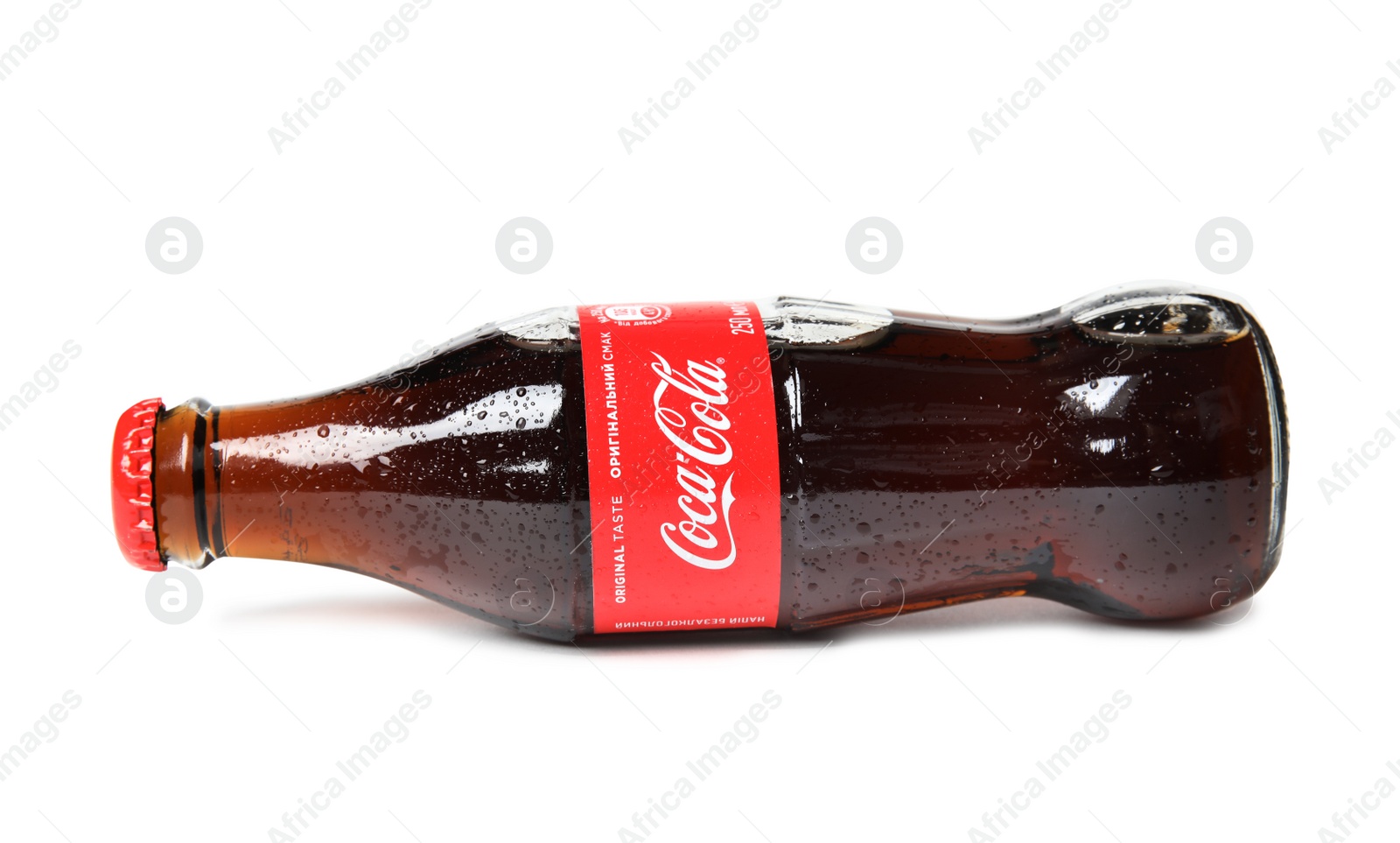 Photo of MYKOLAIV, UKRAINE - NOVEMBER 15, 2018: Glass bottle of Coca Cola on white background